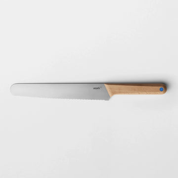 A wooden handled bread knife.