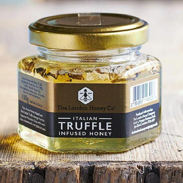 A small glass jar of truffle infused Italian honey.