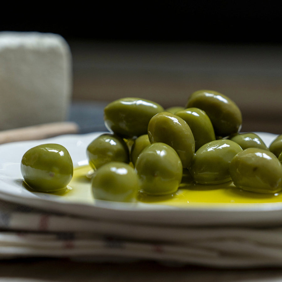 A plate of green olives.